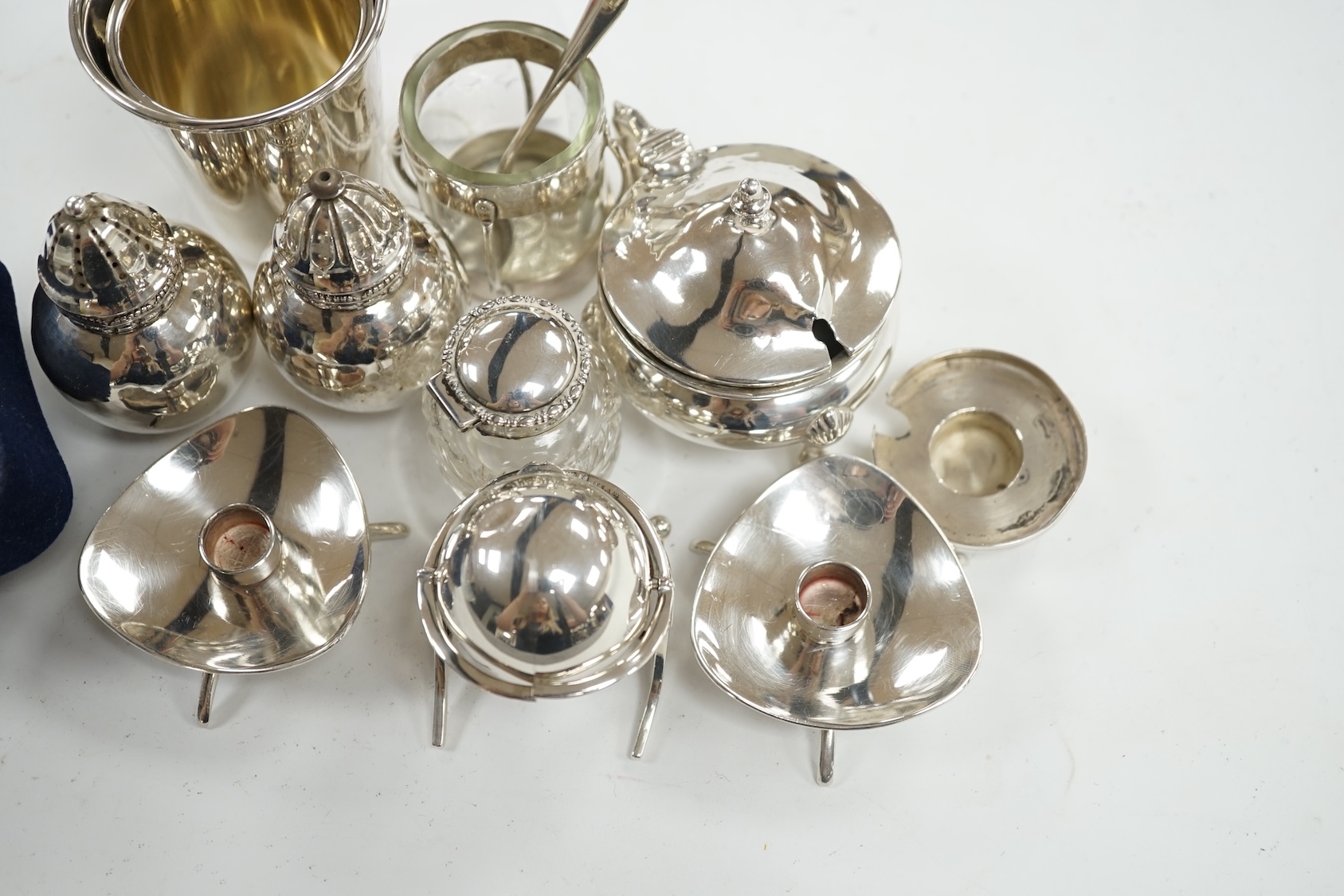 Small silver including an Edwardian miniature silver revolving 'breakfast dish' by Saunders & Shepherd, Birmingham, 1909, height 50mm, four condiments including one modelled as a ship's lamp and two Danish white metal, a